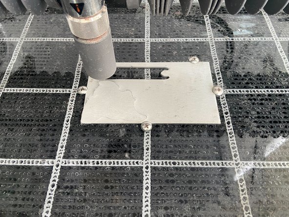 Remember where you placed your cut files in WAM and, using the pattern in the bed and the 5 provided screws, secure your stock in the correct place