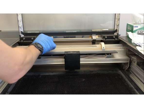 Remove the printer head as described in Step 4 (without disconnecting the ribbon cable). Use compressed air to clean off the circuit board, then replace the printer head.