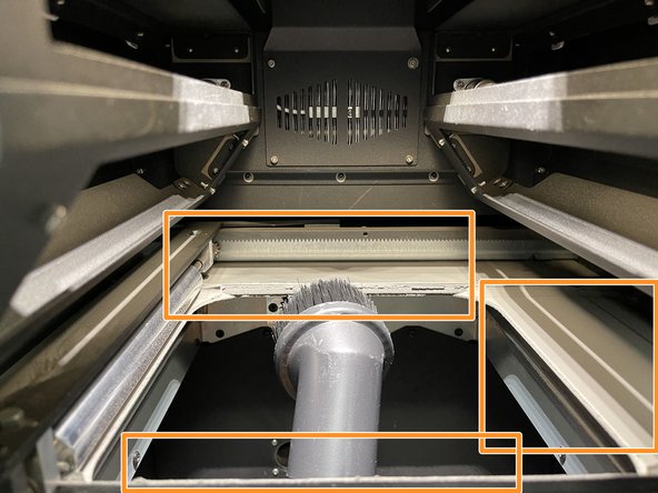 Grab the vacuum hose from the post-processing station and attach the brush-head.