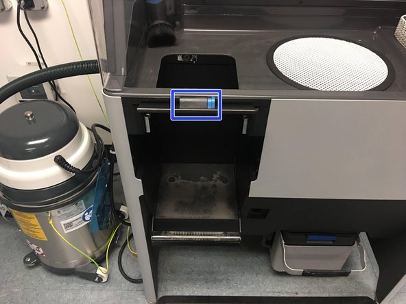 Open the latch with the blue button on the Sift to Prep for transferring the build chamber from the Fuse to the Sift