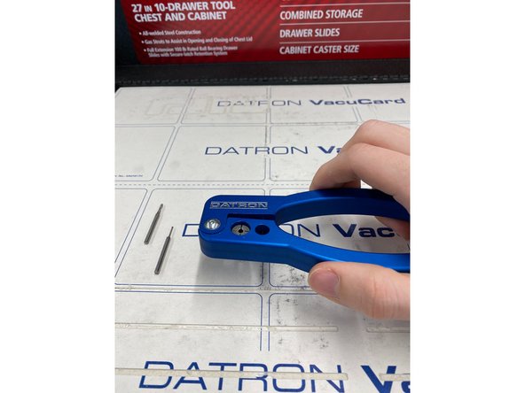 After removing the old tool, simply slip the new tool in the collet whilst still holding on the clamp.