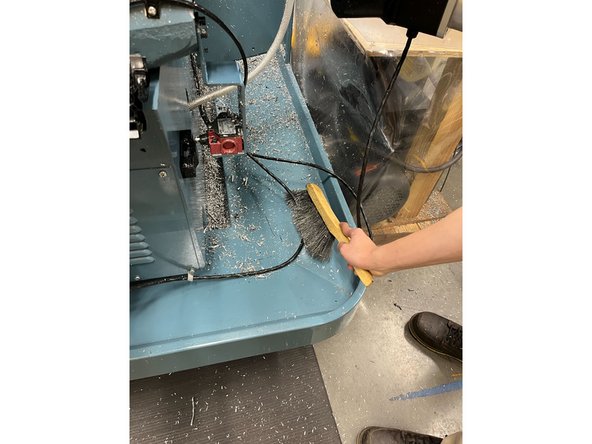 Use the brush the sweep all the chips into the innermost part of the pan on both sides.