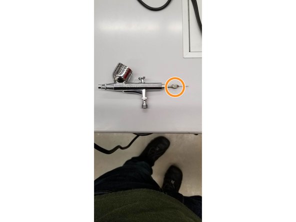 Unscrew the clamp that holds the needle in place.