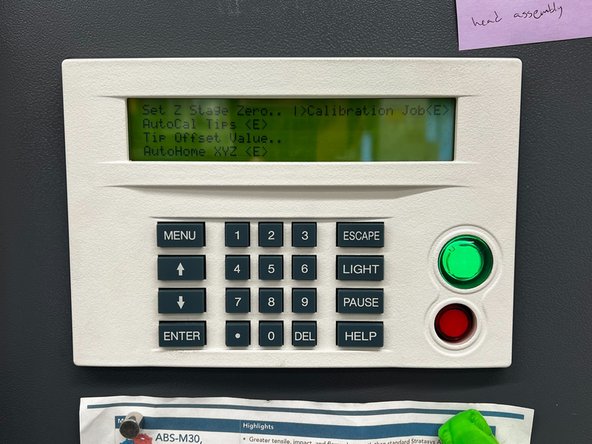 Unlock the oven door from the Reset Tip Odometers page and place a build sheet on the platen