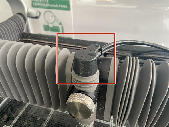 Take the black cap off the cutting head assembly