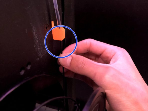 Feed the new filament through the PTFE tube up to the gears