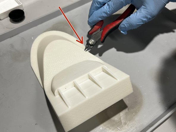 Use the flush cutters to clean up the surface of the model.