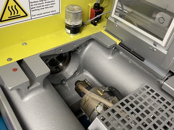 Back the screw up so that the access chamber is mostly clear