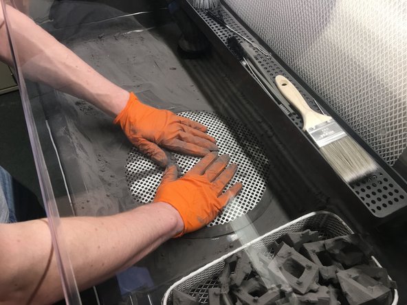 Push the bulk of the remaining powder into the grate