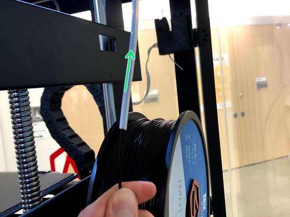 Feed the filament through the PTFE tube
