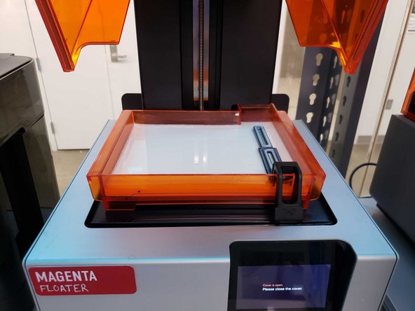 When finished, place the tank back into the machine