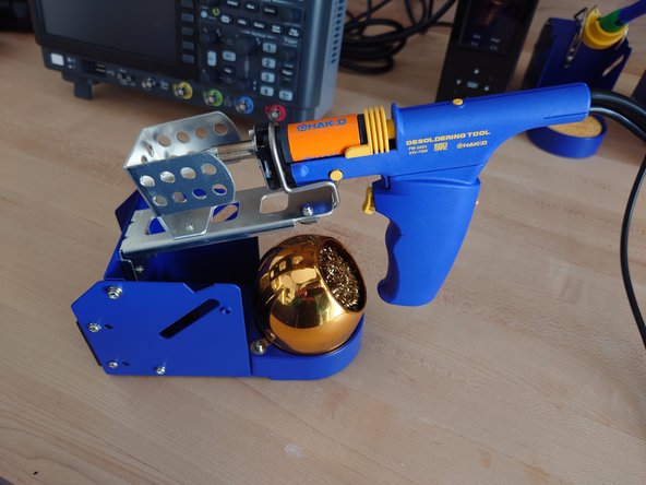 To desolder, first melt the solder in question with the tip, and press the button on the desolderer to suck the solder.