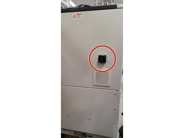 Flip the switch on the back of the machine from on to off.