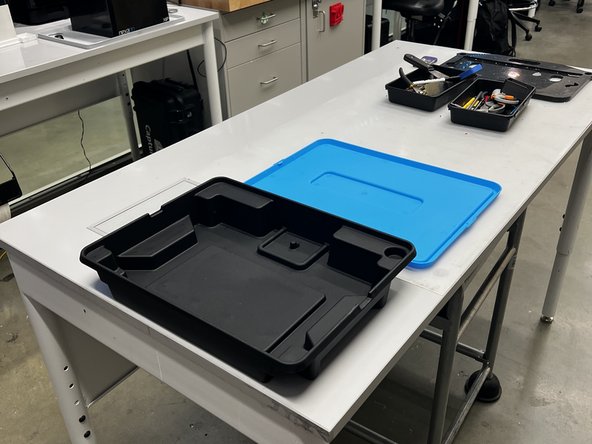 Place the opened box on the table with plenty of space to work.