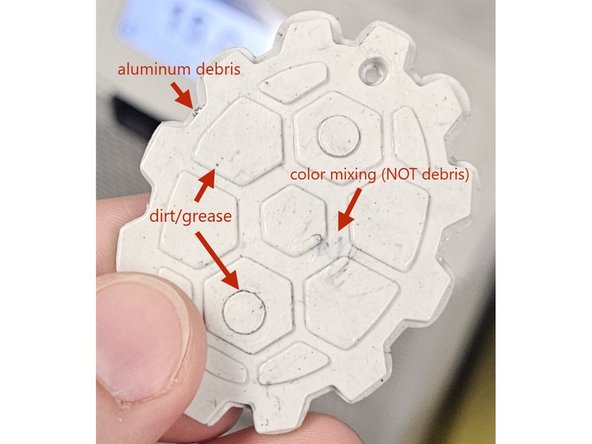 The injection material may also contain an uneven color mixture. For example, a hopper of mostly recycled white PLA with a small amount of black may not mix uniformly during plasticizing.