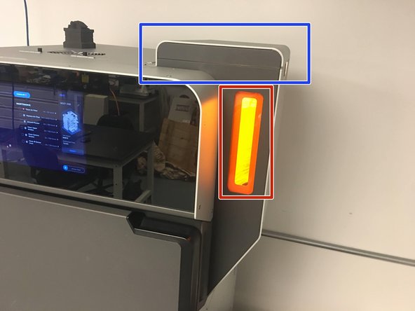 Using the window on the side of the hopper, verify that the powder has settled