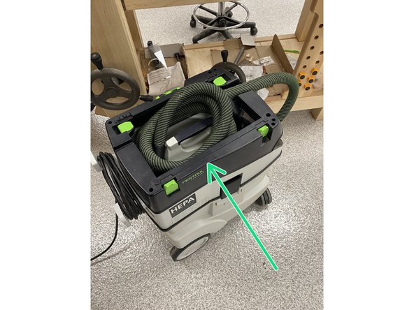 Return the hand sander to its proper tool box.