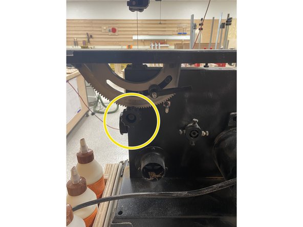 Use the black knob to turn the table to the desired degree.