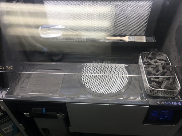 Push the bulk of the remaining powder into the grate