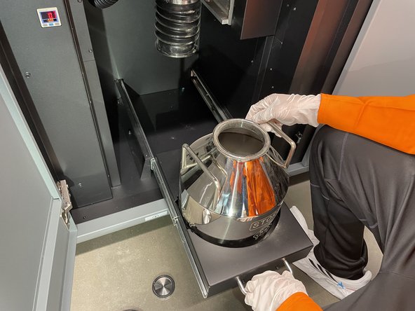 Once the build box has been removed from the printer all the excess powder will be transferred into the store keg below the printer