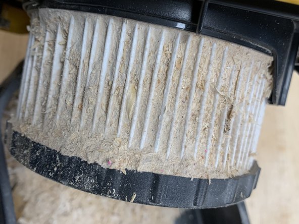 Remove black waste bin and empty into nearest trash can.