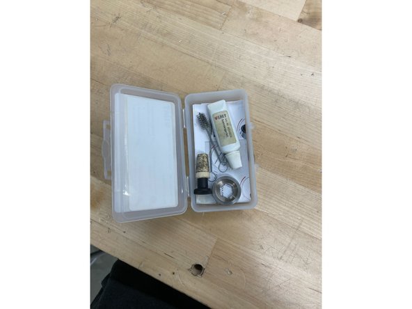 Open the kit and locate the circular unscrewing tool