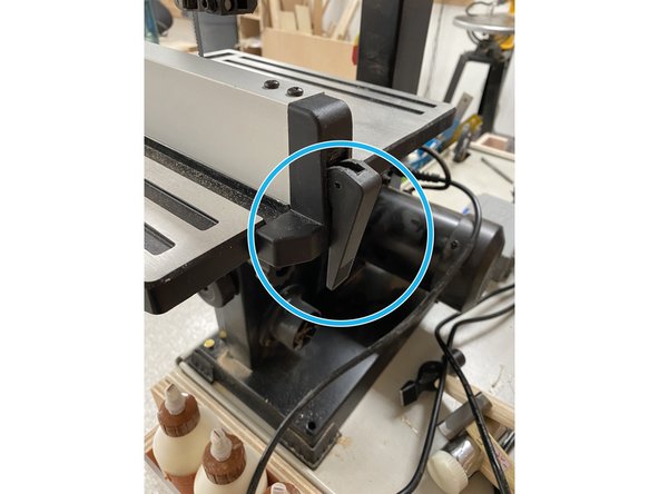 Fences can be mounted across the work plate parallel to the blade as shown.