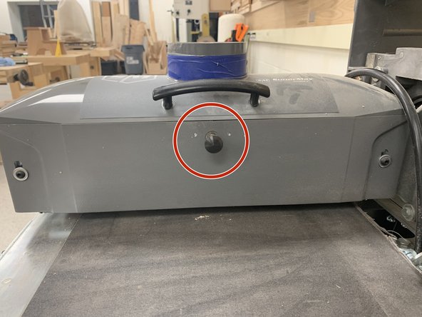 Open drum cover by pressing button and lifting lid.