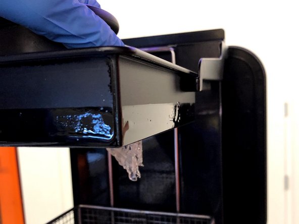 Place the build plate on the arm with the model facing down