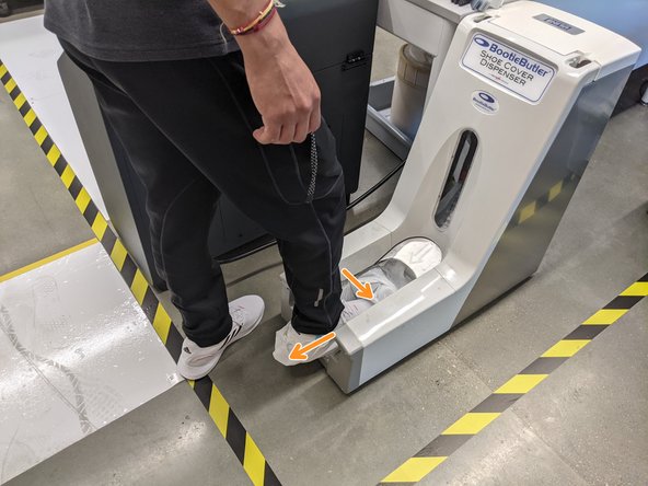 Pull back with heel of foot while extending your toes in order to get the bootie to snap over the toes of your shoes