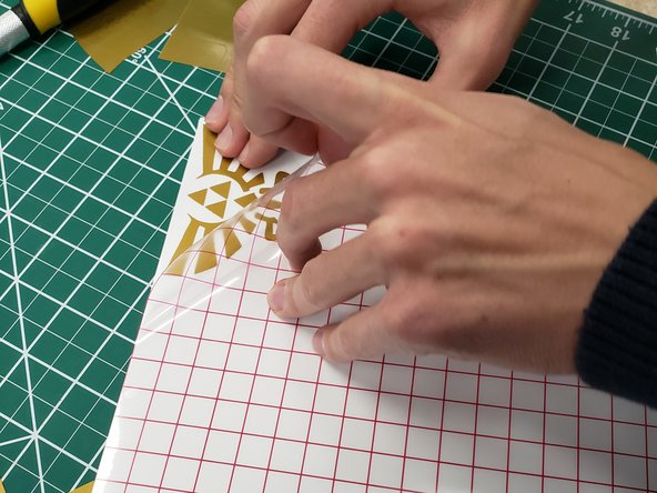 After the transfer paper is carefully applied, cut out the portion of the sheet with the vinyl sticker