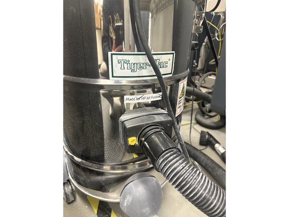 Find the connection point of the vacuum to the vacuum hose. Trace the connection of the vacuum to make sure it is plugged into the Sand blaster and not the brush attachment. If you need to swap out the hoses pull the yellow tab to the left and pull the hose out. Then put the new one in.