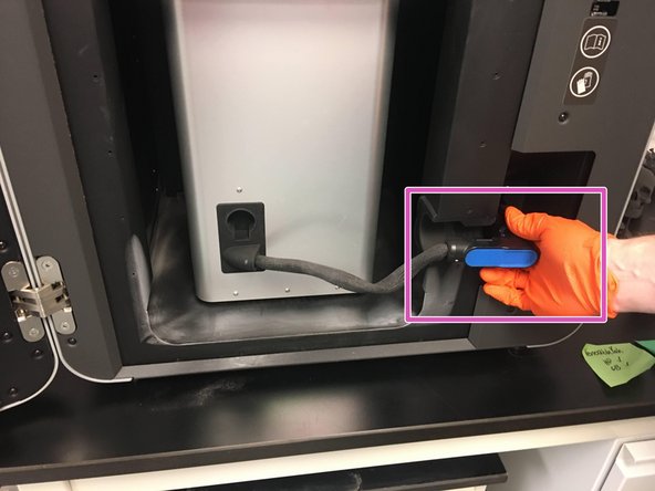 Disconnect and stow the build chamber data cable in the rubber slot on the build chamber