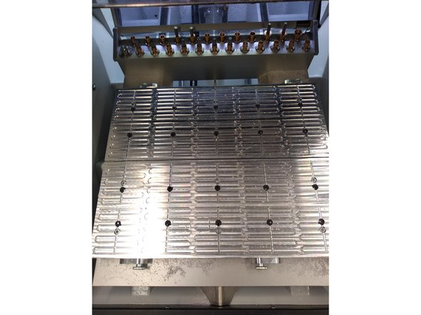 To grease the Y axis, remove the the table as shown in the picture by removing all the bolts.