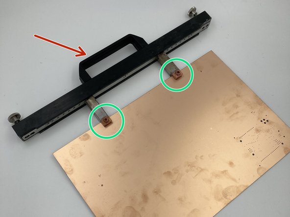 Mount the board in the PCB handle located on the left side of the machine