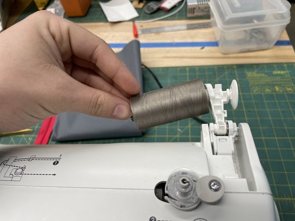 Place the spool on the holder.