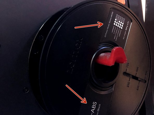 Place the new spool on the spool holder with the label facing outwards