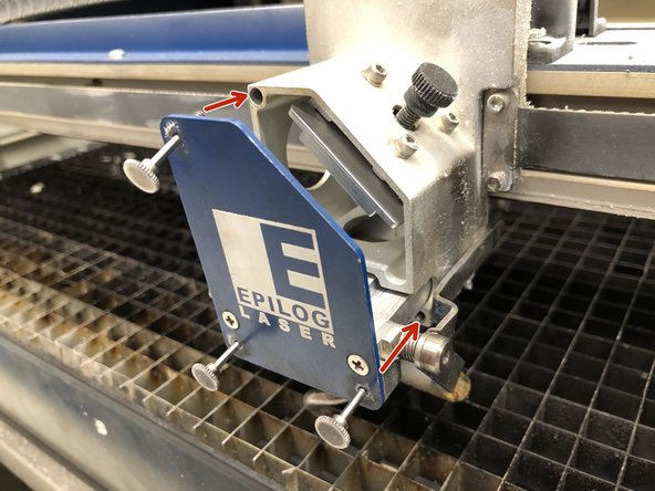 Line up the thumb screws with their proper holes and slide the lens holder into place