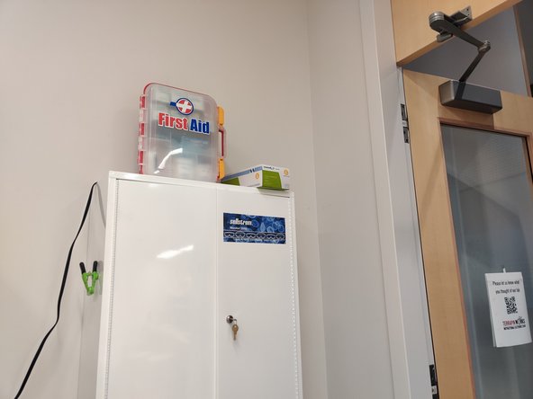 The first aid kit is located to the right as you walk into the space.