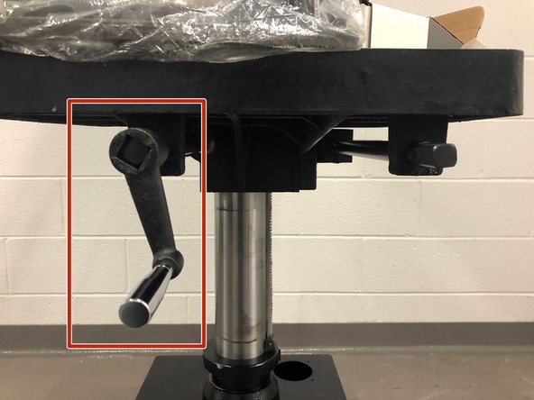 Once desired height is reached, tighten the left bolt to lock the table height in place.
