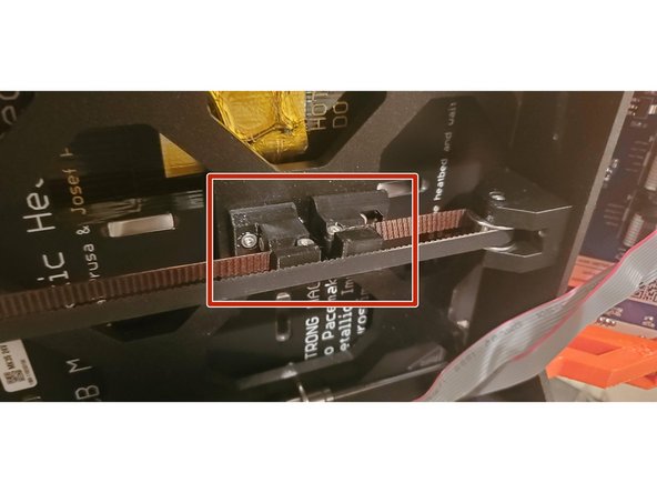 Adjust the tension on the bottom of the carriage