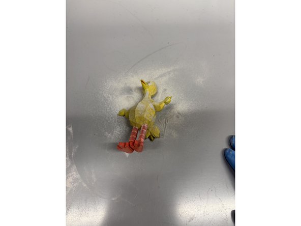 Take your part out of the chamber and place it on the work area. Redo the latches to seal back up the chamber. Swap the vacuum hose connection to the hose with the brush head.