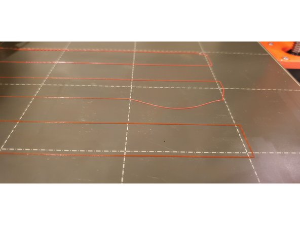 Lower the nozzle by rotating the dial