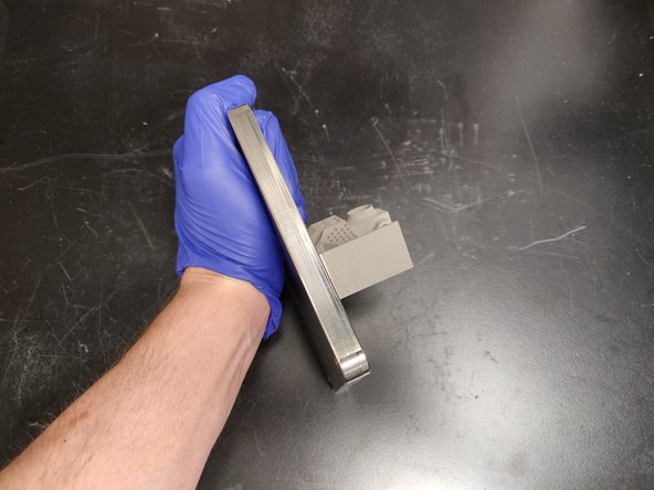 Use vacuum to remove any loose powder