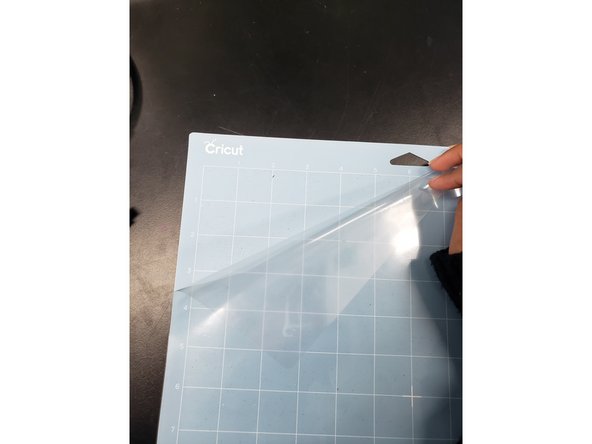 Remove the plastic cover from the cutting mat; save the cover for reapplication later