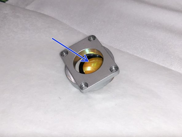 Be sure to not let the lens touch anything but lens paper.