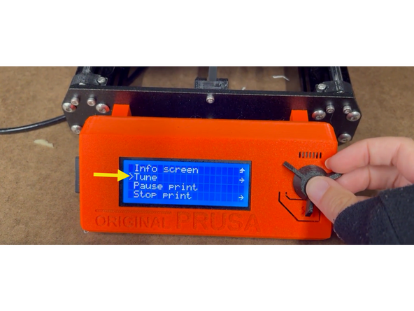 On the home screen in the middle of a print, simply turn the nob to adjust the speed.