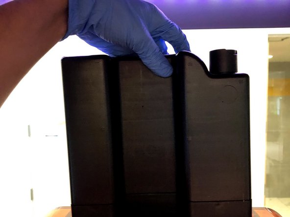 Orient the cartridge so that the label faces away from you