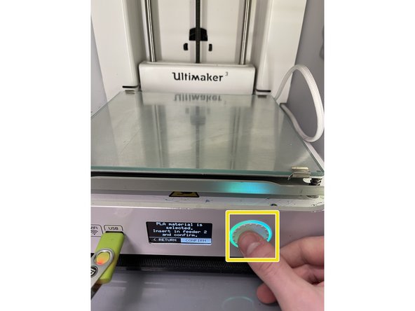 Confirm that you have inserted the material into the feeder by pushing the button on the front of the Ultimaker 3
