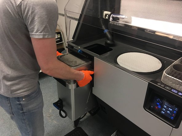 If necessary, use the oven mitts located in the cabinet below the Fuse